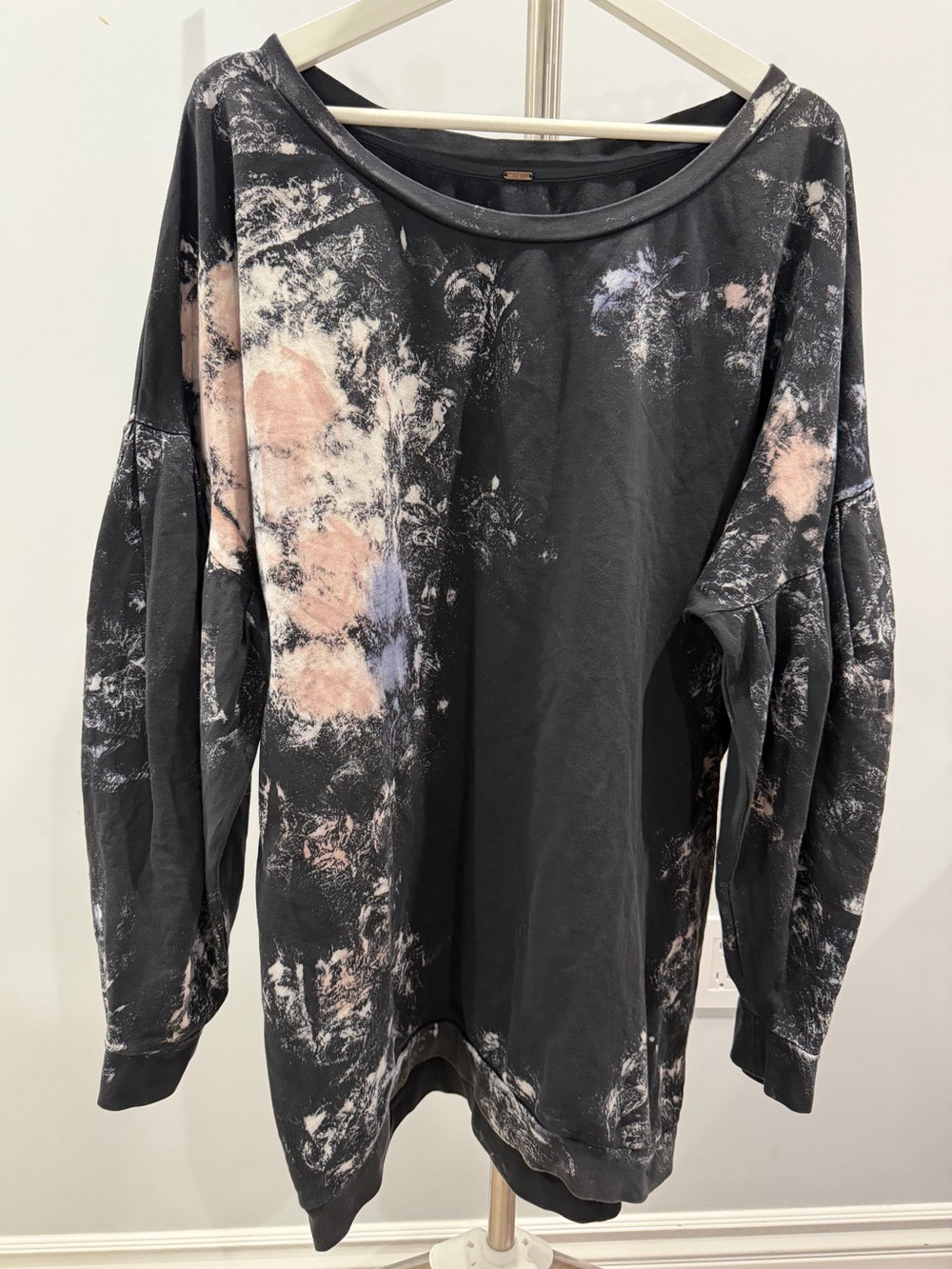Free People black sweatshirt with billowy pleated sleeves and pink bleach effect